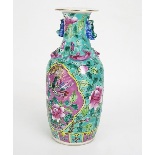 1088 - A Chinese Straits Porcelain Nonya Peranakan Famille Rose Vase decorated with Fènghuáng and chrysanth... 