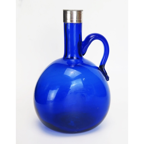 1094 - A Bristol blue glass and silver mounted with scroll handle, 20cm high.