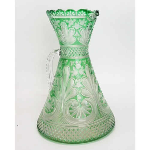 1095 - A late Victorian green glass cordial jug by Stevens & Williams, Stourbridge, of waisted form with et... 