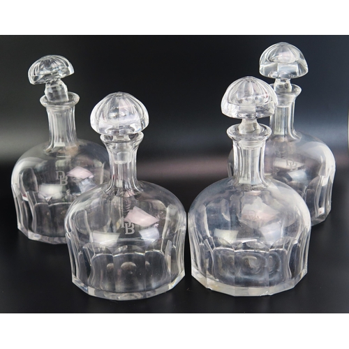 1096 - A set of four German Deutsche Bank clear glass mallet shaped decanters and stoppers with slice cut d... 