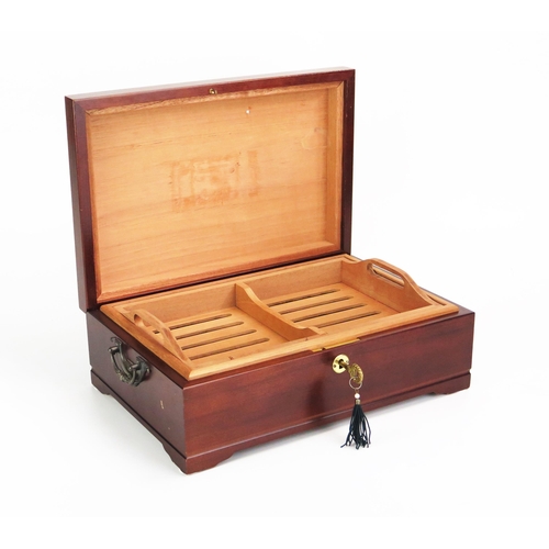 1100 - A mahogany and chequer strung humidor, of rectangular outline, the hinged lid enclosing a slotted li... 