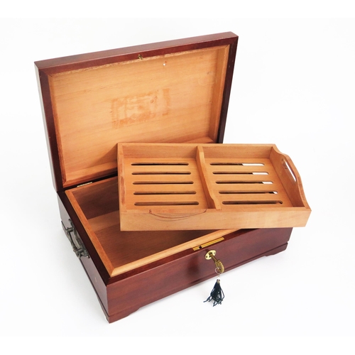 1100 - A mahogany and chequer strung humidor, of rectangular outline, the hinged lid enclosing a slotted li... 