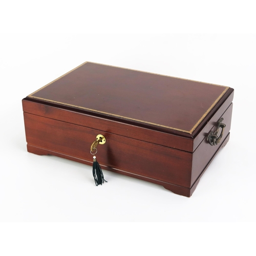 1100 - A mahogany and chequer strung humidor, of rectangular outline, the hinged lid enclosing a slotted li... 