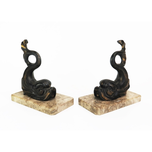 1103 - A pair of bronzed metal bookends, modelled in the form of dolphins, mounted on rectangular polished ... 