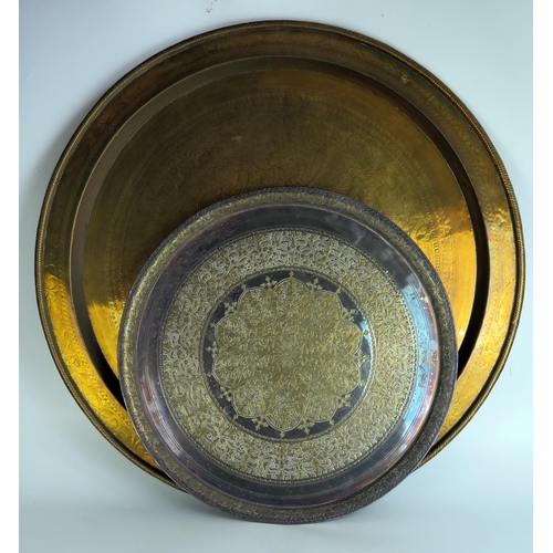 1110 - A Benares brass circular tray or tiffin table top, decorated with elephant, birds and animals, 72cm ... 