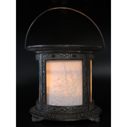 1111 - A late Victorian metal light, of cylindrical outline with lithophane panels of forest scenes, on a c... 