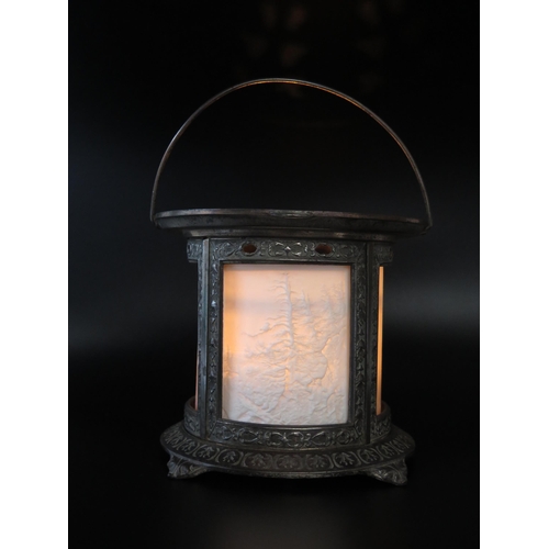 1111 - A late Victorian metal light, of cylindrical outline with lithophane panels of forest scenes, on a c... 