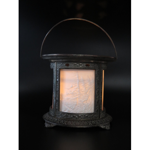 1111 - A late Victorian metal light, of cylindrical outline with lithophane panels of forest scenes, on a c... 