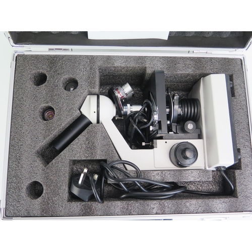 1132 - An Apex monocular microscope, with two eyepieces, course and fine focusing, rotating triple nose wit... 