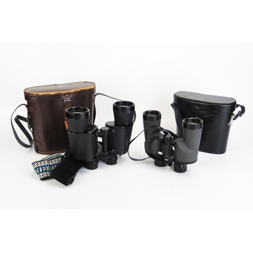 1133 - A pair of Pacific 10x 50 binoculars, in fitted case together with a pair of Swift County Mk 1 10 x 4... 