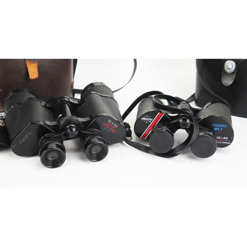 1133 - A pair of Pacific 10x 50 binoculars, in fitted case together with a pair of Swift County Mk 1 10 x 4... 