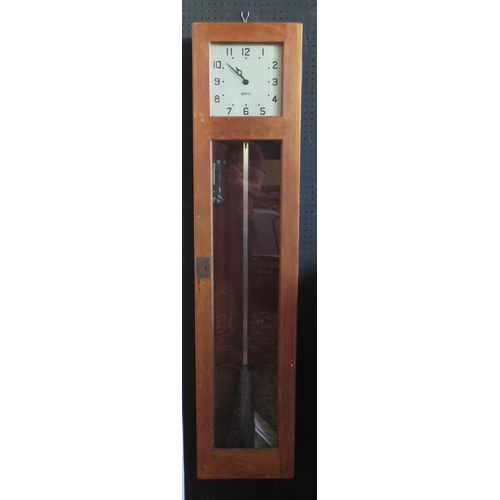 1145 - A GENTS master clock contained in an oak case, with pendulum, 127cm high