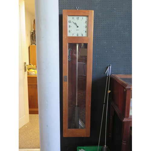 1145 - A GENTS master clock contained in an oak case, with pendulum, 127cm high