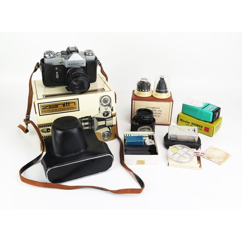 1148 - A Zenith B 35mm SLR camera, together with assorted camera accessories.