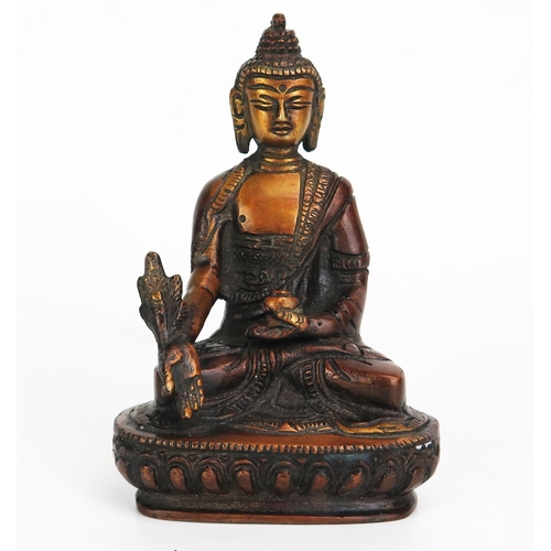 1151 - A bronze model of Buddha, seated crossed legged on a lotus flower, 14cm high.