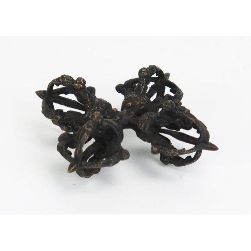 1153 - A Buddhist Dorje Vajra meditation ritual tool, of cruciform outline, 9cm wide.