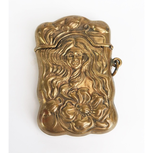 1179 - A reproduction pressed brass vesta case, of Art Nouveau influence, 6.5cm long.