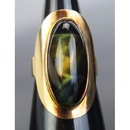 120 - A Yellow Metal and Hawk Eye Dress Ring, KEE tested as 14K, 29.5mm long head, size M, 7.56g