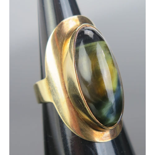 120 - A Yellow Metal and Hawk Eye Dress Ring, KEE tested as 14K, 29.5mm long head, size M, 7.56g