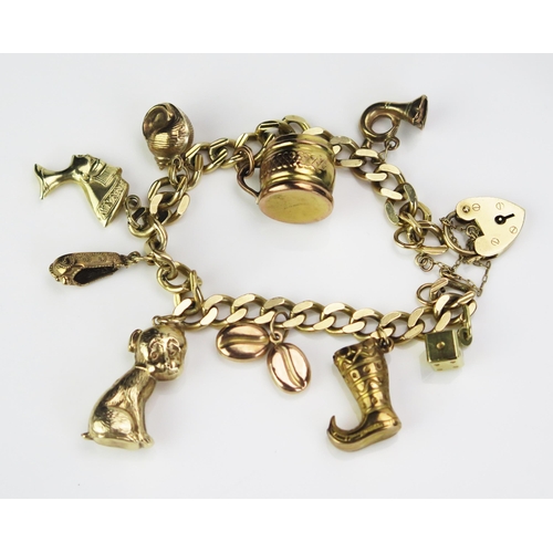 123 - A 9ct Gold Charm Bracelet with Mongolian boot, puppy, beer mug, etc., 22.58g