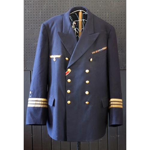 1301 - A German World War II Kreigsmarine Kapitänleutnant navy blue jacket by Ernst Brendler, Hamburg, with... 