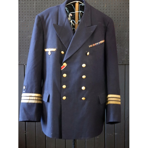 1301 - A German World War II Kreigsmarine Kapitänleutnant navy blue jacket by Ernst Brendler, Hamburg, with... 