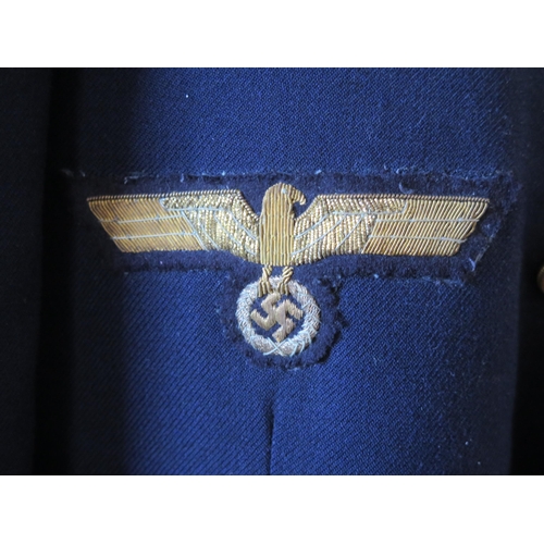 1301 - A German World War II Kreigsmarine Kapitänleutnant navy blue jacket by Ernst Brendler, Hamburg, with... 