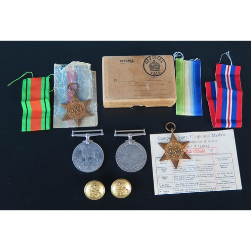 1312 - A group of four World War II medals includes Atlantic Star, 19139-45 Star, War and Defence Medal in ... 