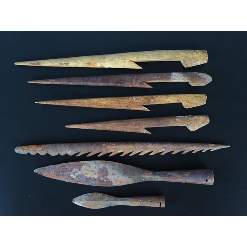 1323 - A collection of five bone fishing spear tips, together with two steel spear tips.