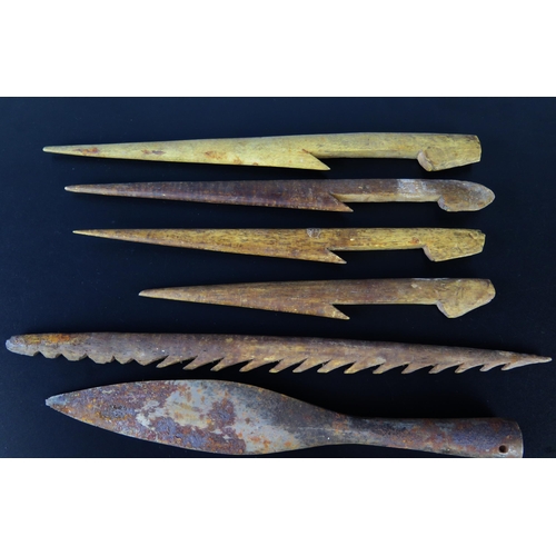 1323 - A collection of five bone fishing spear tips, together with two steel spear tips.