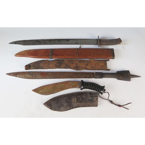 1326 - A Malayan style kukri contained in a leather sheath, together with two other tribal swords. (3).