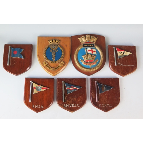 1330 - A collection of Wardroom badges and shipping line badges on shield-shaped plaques. (7)