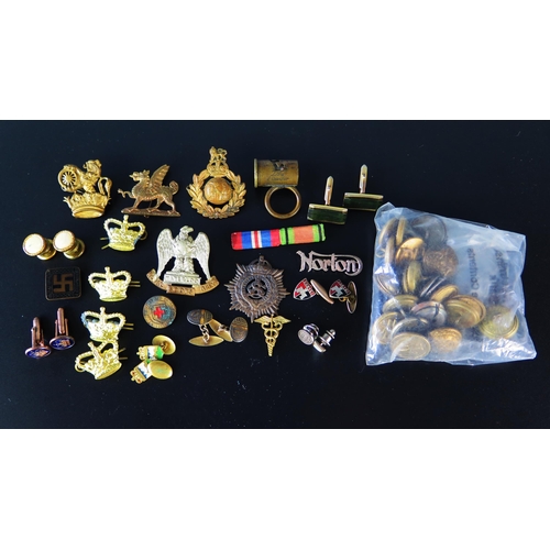 1331 - A small collection of military cap badges, British Rail buttons, collar studs etc.