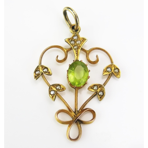 134 - A Peridot and untested Seed Pearl Pendant in a precious yellow metal setting, 38mm drop, 1.83g