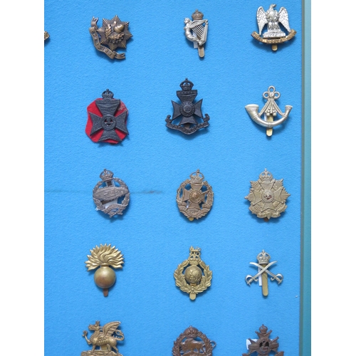 1349 - A collection of British army cap badges including Sussex, Wiltshire, Middlesex, East Surrey, Cheshir... 