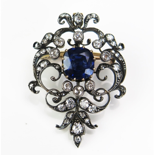 135 - An Antique Sapphire and Diamond Brooch with hinged pendant mount, the 9x8.8mm claw set deep blue sap... 