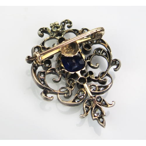 135 - An Antique Sapphire and Diamond Brooch with hinged pendant mount, the 9x8.8mm claw set deep blue sap... 