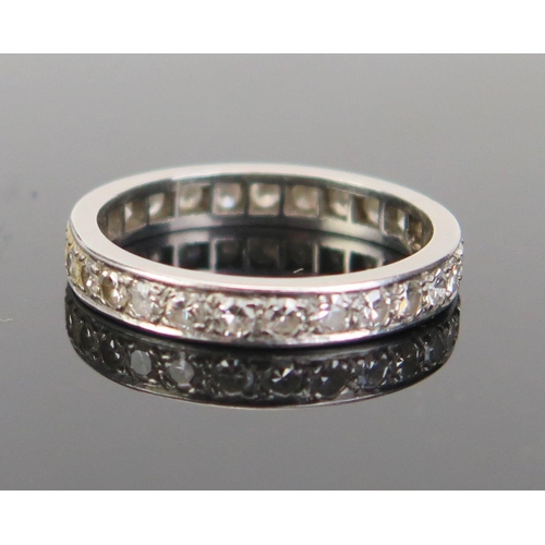 138 - A Diamond Eternity Ring in an unmarked precious white metal setting, c. 2.5mm stones, size P.25, 4.1... 