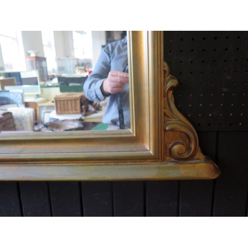 1408 - A faux giltwood Victorian style over mantel mirror of arched outline 109 x 89cm.