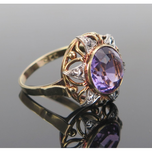 143 - A 9ct Gold and Amethyst Dress Ring, 11mm stone, 19mm head, marked 9CT, size Q.5, 6g