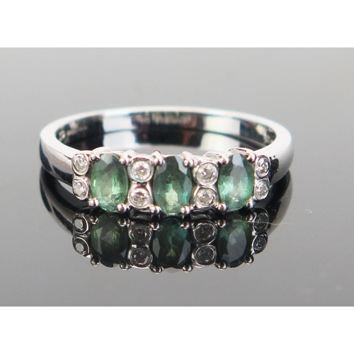 145 - A 10K White Gold, Gem Set and Diamond Dress Ring, 16x10mm head, stamped 10K and 375 continental mark... 