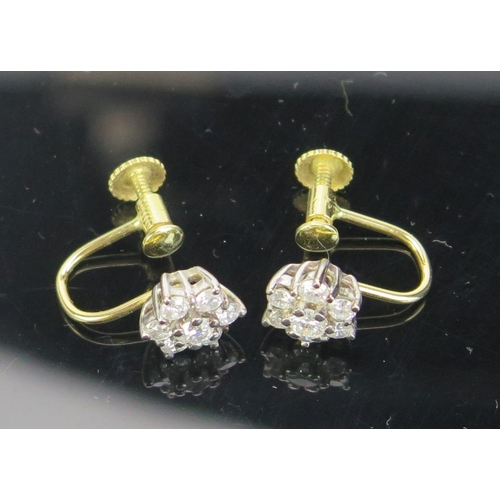 148 - A Pair of Diamond Seven Stone Cluster Earrings, unmarked precious yellow and white metal screw back ... 