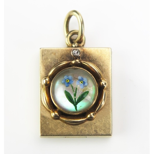 155 - An Antique Forget-Me-Not Crystal Metamorphic Pendant Locket set with a rose cut diamond, in a precio... 