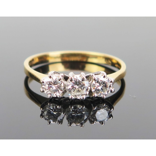 156 - An 18ct Gold and Diamond Three Stone Ring, 4mm brilliant round cut stones, import marks, size L, 2.1... 