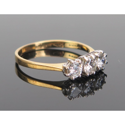 156 - An 18ct Gold and Diamond Three Stone Ring, 4mm brilliant round cut stones, import marks, size L, 2.1... 