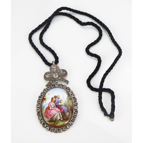 157 - An Antique Paste and Enamel Pendant decorated with a Watteauesque paramours scene, 68.5mm drop