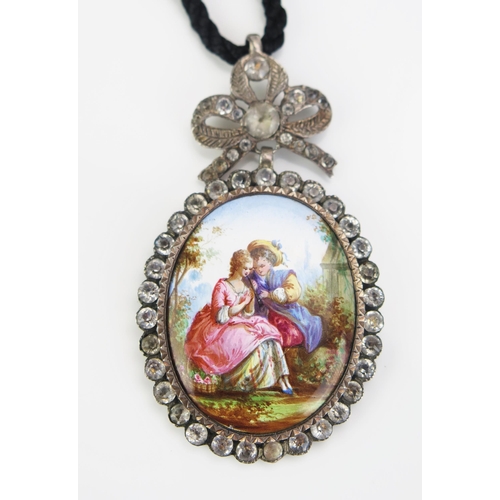 157 - An Antique Paste and Enamel Pendant decorated with a Watteauesque paramours scene, 68.5mm drop