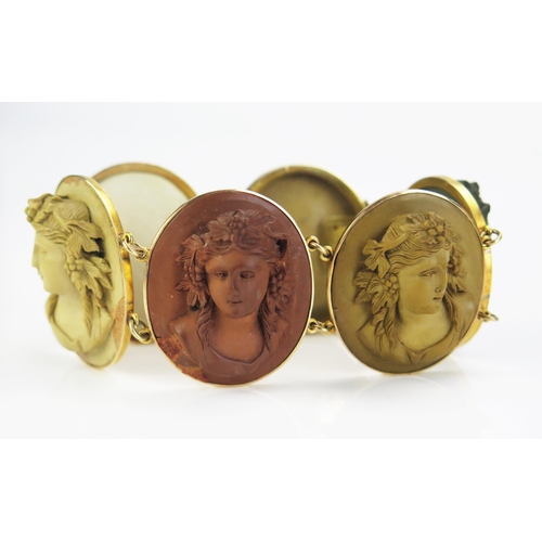 158 - A Large Antique Cameo Lava Bracelet in a precious yellow metal setting, the six 35x30mm high relief ... 