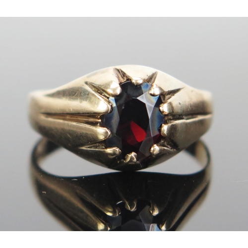 159 - A Gent's 9ct Gold and Garnet Ring, c. 9x7.5mm stone, hallmarked, size V.5, 4.25g