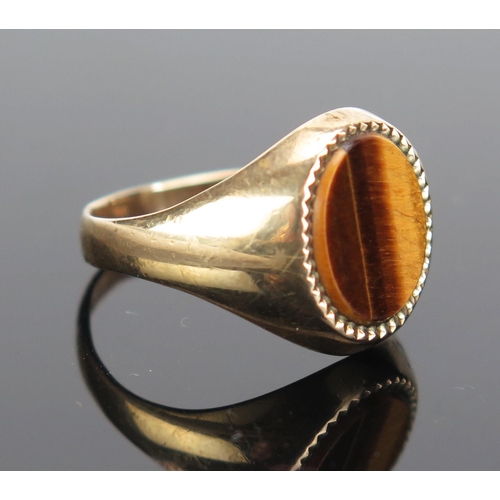 161 - A 9ct Gold and Tiger's Eye Signet Ring, hallmarked, size R.25, 3.55g